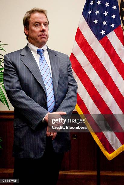 William "Bill" Ford, chairman of Ford Motor Co., listens during a news conference with Gary Locke, U.S. Secretary of commerce, in Washington, D.C.,...