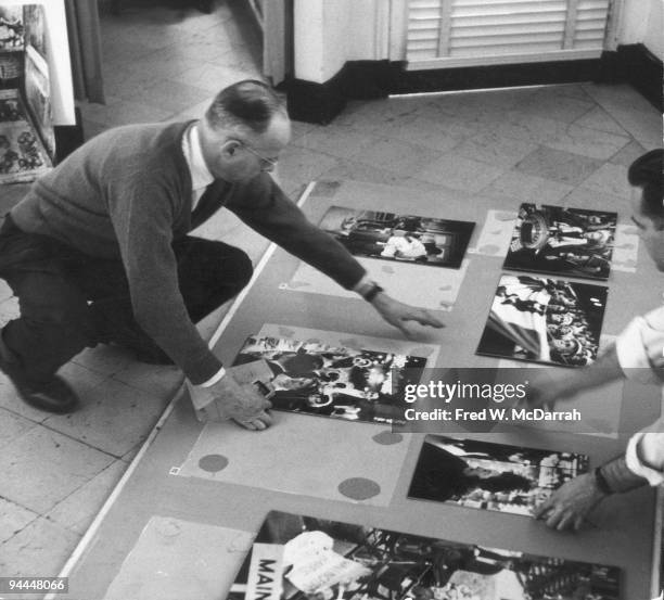 French photographer Henri Cartier-Bresson prepares for his 'The Decisive Moment' exhibition at the IBM Gallery, New York, New York, January 25, 1960.