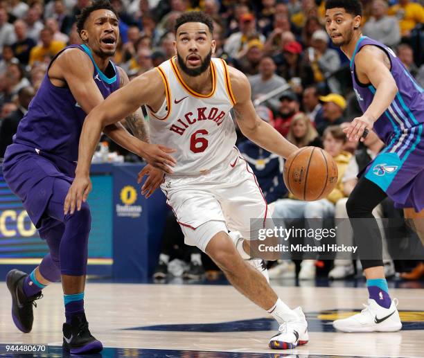 Cory Joseph of the Indiana Pacers drives to the basket against Malik Monk of the Charlotte Hornets at Bankers Life Fieldhouse on March 15, 2018 in...