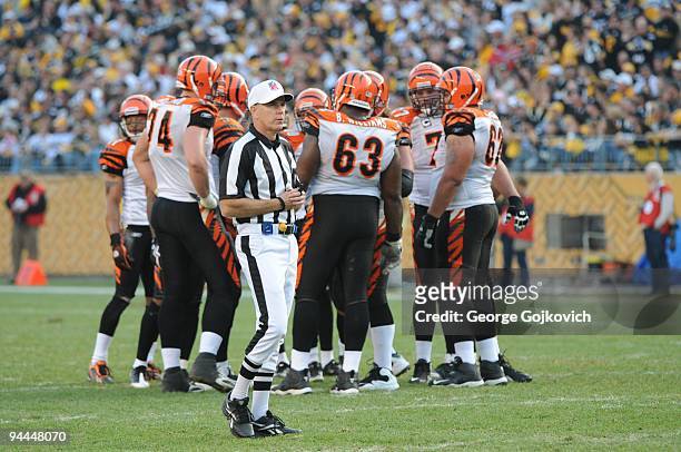 National Football League referee Terry McAulay looks on from the field as the Cincinnati Bengals offense huddles during a game against the Pittsburgh...