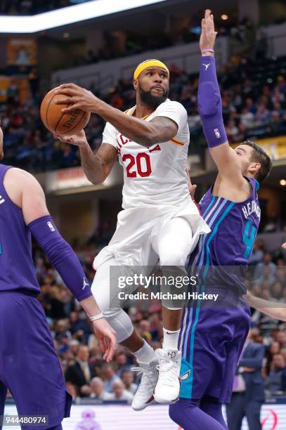 Trevor Booker of the Indiana Pacers shoots the ball against Willy Hernangomez of the Charlotte Hornets at Bankers Life Fieldhouse on March 15, 2018...