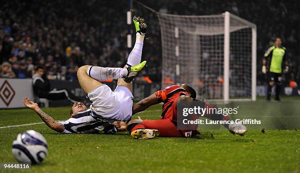 Joe Mattock of West Bromwich Albion battles with Mikele Leigertwood of QPR during the Coca-Cola Championship match between West Bromwich Albion and...