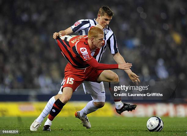 Chris Wood of West Bromwich Albion pulls the shirt of Ben Watson of QPR during the Coca-Cola Championship match between West Bromwich Albion and...