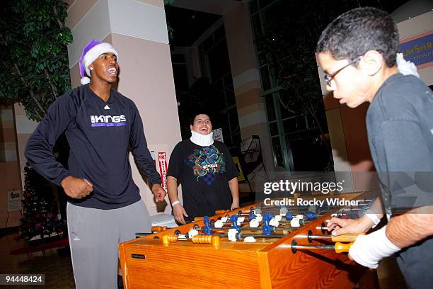 Jason Thompson of the Sacramento Kings celebrates his play on December 13, 2009 at Shriners Hospital for Children in Sacramento, California. NOTE TO...