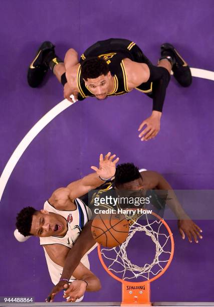 Giannis Antetokounmpo of the Milwaukee Bucks looks up for a rebound with Julius Randle and Josh Hart of the Los Angeles Lakers at Staples Center on...