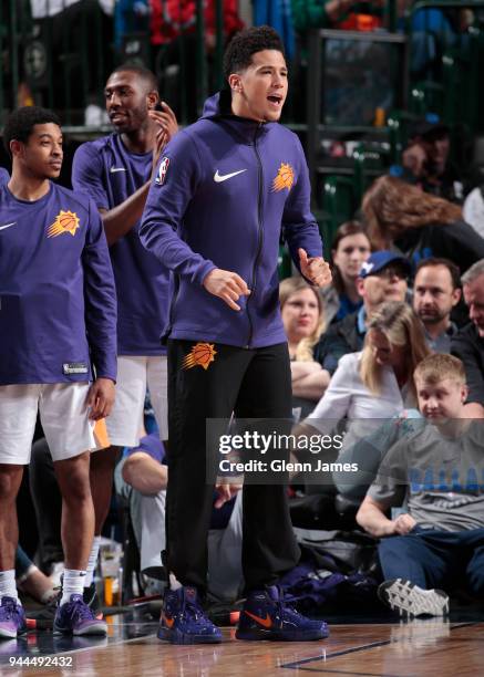 Devin Booker of the Phoenix Suns reacts during the game against the Dallas Mavericks on April 10, 2018 at the American Airlines Center in Dallas,...