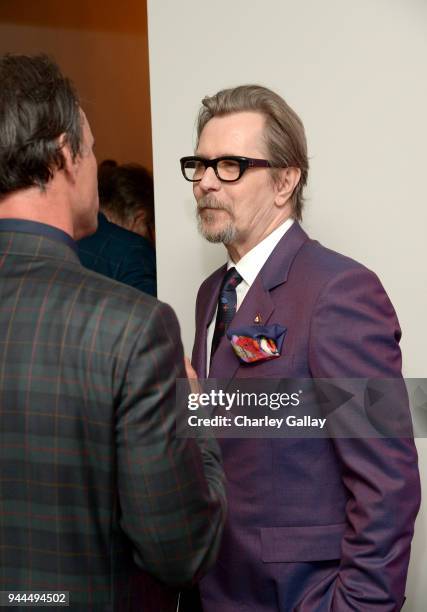 Walton Goggins and Gary Oldman, wearing Paul Smith, attend Paul Smith's intimate dinner with Gary Oldman at Chateau Marmont on April 10, 2018 in Los...