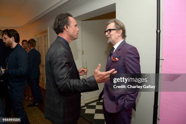 Walton Goggins and Gary Oldman, wearing Paul Smith, attend Paul Smith's intimate dinner with Gary Oldman at Chateau Marmont on April 10, 2018 in Los...