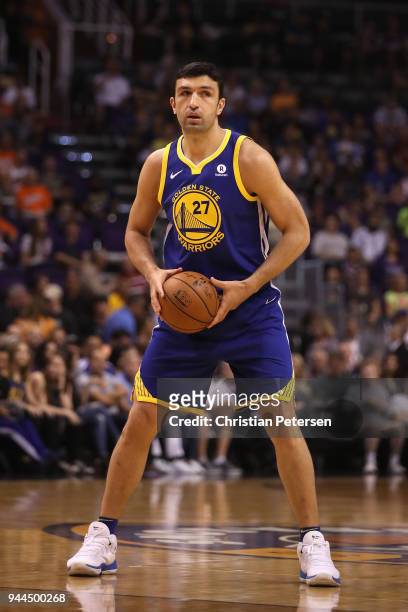 Zaza Pachulia of the Golden State Warriors looks to pass during the first half of the NBA game against the Phoenix Suns at Talking Stick Resort Arena...