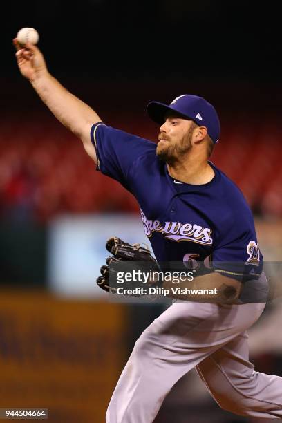 Hoover of the Milwaukee Brewers delivers a pitch against the St. Louis Cardinals in the tenth inning at Busch Stadium on April 10, 2018 in St. Louis,...