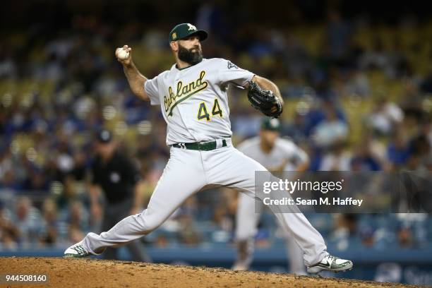 Chris Hatcher of the Oakland Athletics pitches during the eighth inning of a game against the Los Angeles Dodgers at Dodger Stadium on April 10, 2018...