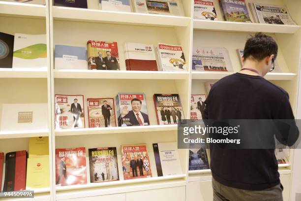 Copies of magazines featuring Chinese President Xi Jinping on the cover are displayed in a stand at the Boao Forum for Asia Annual Conference in...