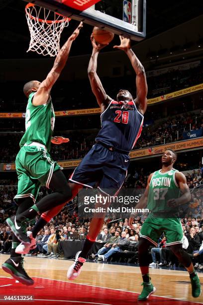 Ian Mahinmi of the Washington Wizards goes to the basket against the Boston Celtics on April 10, 2018 at Capital One Arena in Washington, DC. NOTE TO...