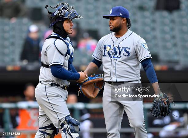 Tampa Bay Rays catcher Wilson Ramos and Tampa Bay Rays relief pitcher Alex Colome shake hands after getting the win against the Chicago White Sox on...