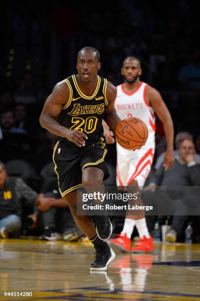 Andre Ingram of the Los Angeles Lakers dribbles the ball as Chris Paul of the Houston Rockets looks on, on April 10, 2018 at STAPLES Center in Los...