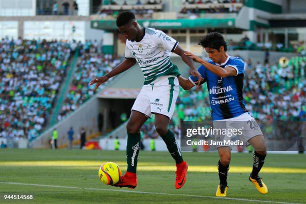 Jorge Djaniny Tavares of Santos and Jaime Gomez of Queretaro fight for the ball during the 14th round match between Santos Laguna and Queretaro as...