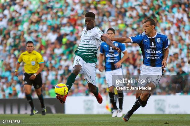 Jorge Djaniny Tavares of Santos and Diego Novaretti of Queretaro fight for the ball during the 14th round match between Santos Laguna and Queretaro...