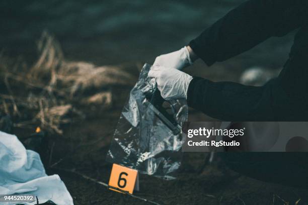 a gun as evidence number six - dead person photos stock pictures, royalty-free photos & images