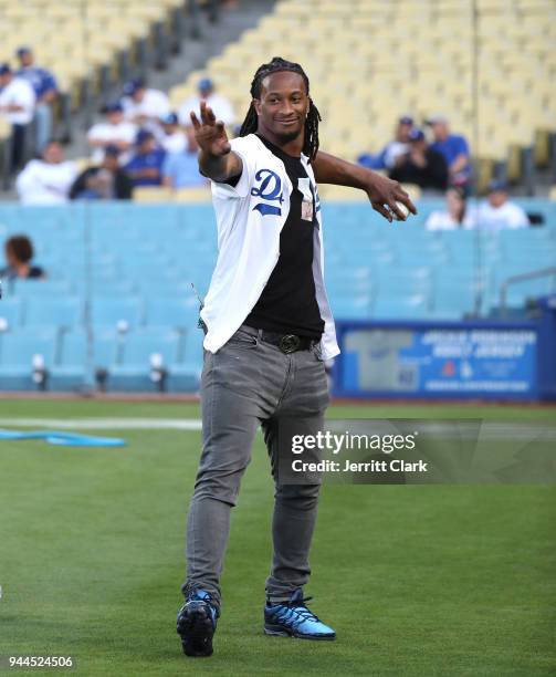 Player Todd Gurley practices his throw prior to throwing out the first pitch at The Los Angeles Dodgers Game at Dodger Stadium on April 10, 2018 in...