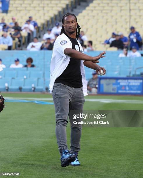 Player Todd Gurley practices his throw prior to throwing out the first pitch at The Los Angeles Dodgers Game at Dodger Stadium on April 10, 2018 in...