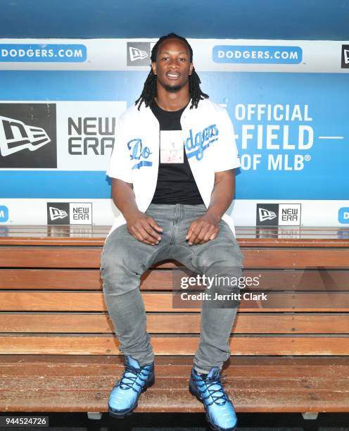 Player Todd Gurley poses for a photo in the Dodgers dugout prior to throwing out the first pitch at The Los Angeles Dodgers Game at Dodger Stadium on...