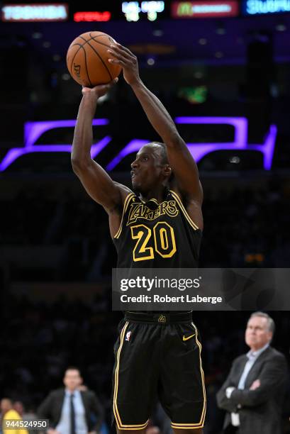 Andre Ingram of the Los Angeles Lakers attempts a jump shot as Mike D'Antoni head coach of the Houston Rockets looks on, on April 10, 2018 at STAPLES...