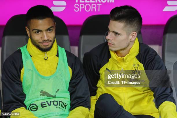 Jeremy Toljan of Dortmund and Julian Weigl of Dortmund sit on the bench prior to the Bundesliga match between Bayern Muenchen and Borussia Dortmund...