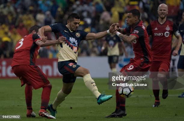 Henry Martin of America and Gregory Van Der Wiel of Toronto fight for the ball during the semifinal second leg match between America and Toronto at...