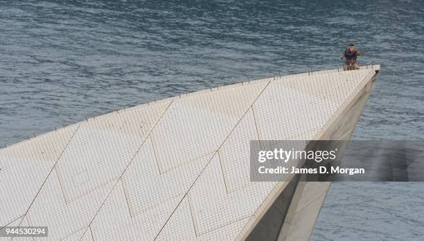 The character Rafiki from Disney's The Lion King performs on top of the sails of the Opera House on May 08, 2013 in Sydney, Australia. Announcing the...