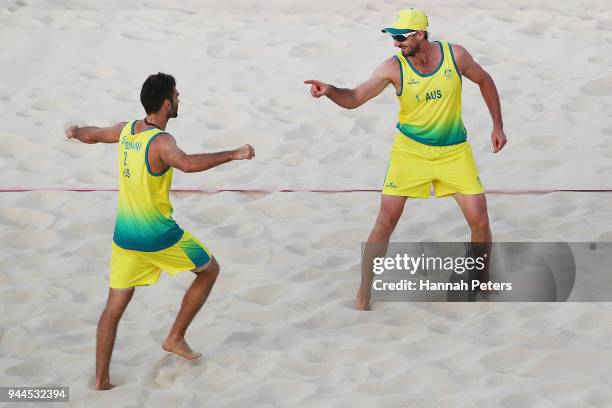 Christopher McHugh and Damien Schumann of Australia celebrate a point during the Beach Volleyball Men's semifinal match between Christopher McHugh...