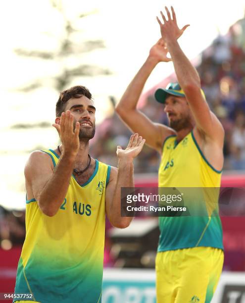 Damien Schumann and Christopher McHugh of Australia celebrate victory during the Beach Volleyball Men's Semi Final match between Australia and...