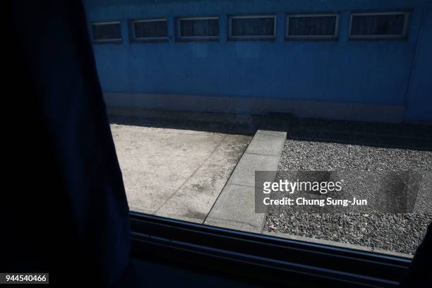 The Military Demarcation Line is seen at the border village of Panmunjom between South and North Korea at the Demilitarized Zone on April 11, 2018 in...