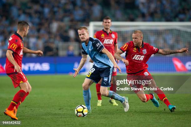 Matthew Simon of the Sydney gets past Adelaide's Taylor Regan during the round 26 A-League match between Sydney FC and Adelaide United at Allianz...