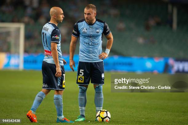 Adrian Mierzejewski of the Sydney prepares to take a free kick with teammate Jordy Buijs holds his foot during the round 26 A-League match between...