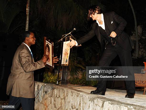 Bahamian Artist presents actor Johnny Depp with his painting at the 6th Annual Bahamas Film Festival special tribute and presentation at the Balmoral...