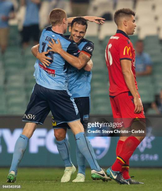 Matthew Simon of the Sydney celebrates scoring a goal with teammate Deyvison Rogerio da Silva, Bobo during the round 26 A-League match between Sydney...