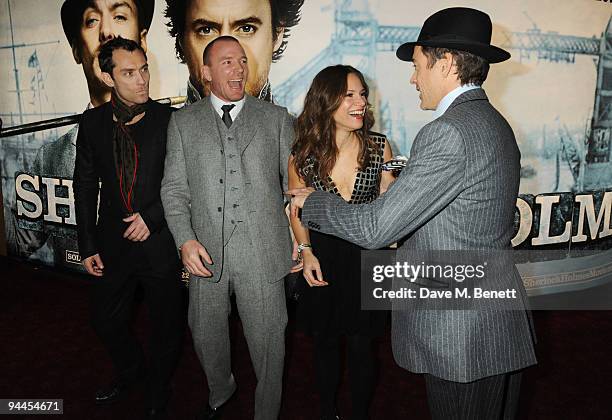 Jude Law, Guy Ritchie, Susan Levin and Robert Downey Jnr arrive at the World Premiere of 'Sherlock Holmes', at the Empire Cinema Leicester Square on...