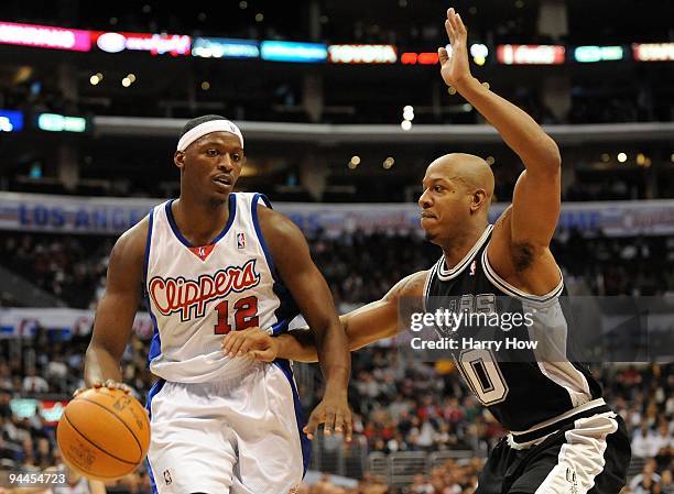 Al Thornton of the Los Angeles Clippers is guarded by Keith Bogans of the San Antonio Spurs at Staples Center on December 13, 2009 in Los Angeles,...