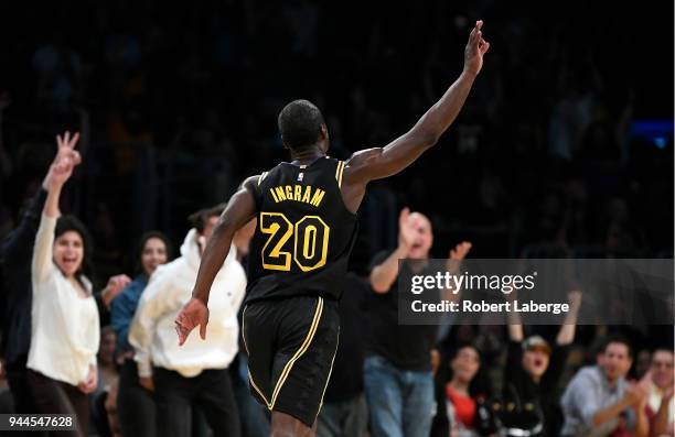 Andre Ingram of the Los Angeles Lakers celebrates after making a three pointer in the second half of the game against the Houston Rockets on April...