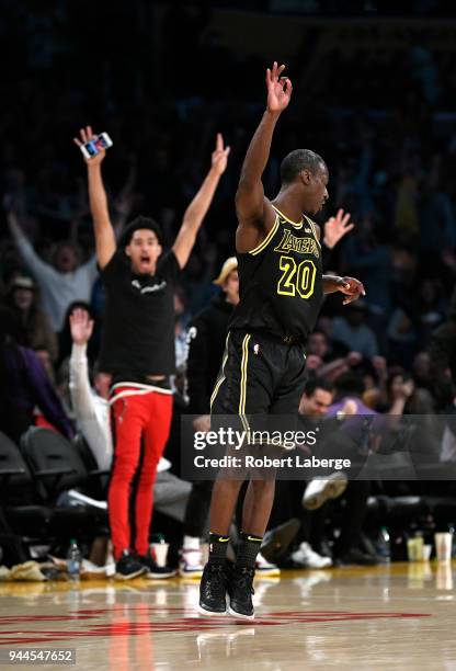 Andre Ingram of the Los Angeles Lakers celebrates after making a three pointer in the second half of the game against the Houston Rockets on April...