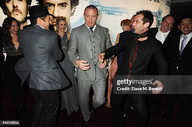 Robert Downey Jnr, Guy Ritchie and Jude Law arrive at the World Premiere of 'Sherlock Holmes', at the Empire Cinema Leicester Square on December 14,...