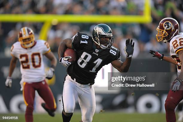 Wide Receiver Jason Avant of the Philadelphia Eagles stiff arms cornerback Carlos Rogers of the Washington Redskins on November 29, 2009 at Lincoln...