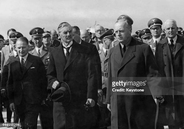 British Prime Minister Neville Chamberlain with German Foreign Minister Joachim von Ribbentrop upon his arrival in Cologne, Germany, en route to Bad...