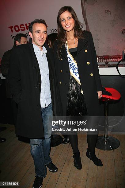 Miss France 2009 Malika Menard and Elie Semoun attend the Toshiba 'Go to Space' party at Palais De Tokyo on December 14, 2009 in Paris, France.
