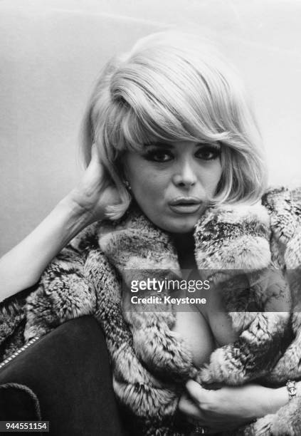 French actress and entertainer Coccinelle in Wiesbaden, Germany, where she is performing in a nightclub, 23rd February 1965. She underwent gender...