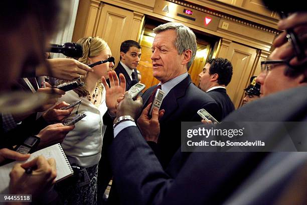 Senate Finance Committee Chairman Max Baucus talks with reporters after a Senate Democratic caucus meeting at the U.S. Capitol December 14, 2009 in...