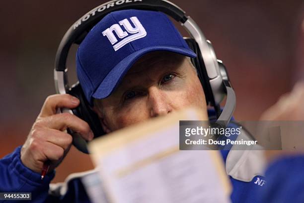 Head coach Tom Coughlin of the New York Giants looks on from the sidelines as he leads his team against the Denver Broncos during NFL action at...
