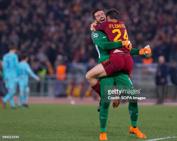 Alessandro Florenzi and Allison of Rome celebrate the victory during UEFA Champions League quarter final match between AS Roma and FC Barcelona at...