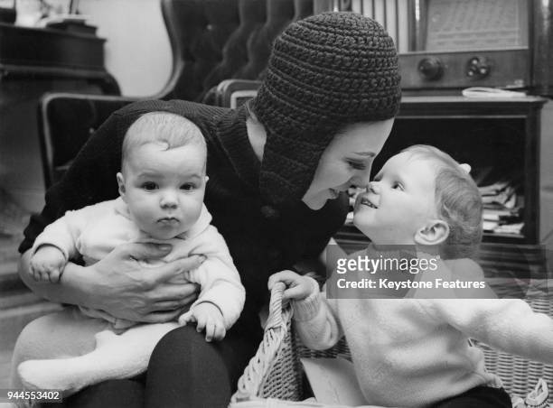 British actress Joan Collins, wife of actor and singer Anthony Newley, with her daughter Tara and son Alexander, at the Palace Hotel during a holiday...