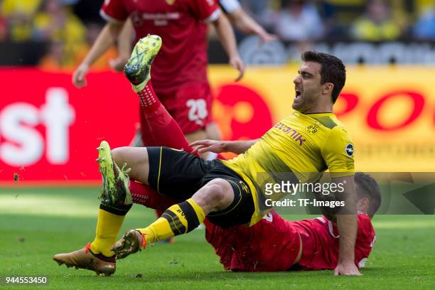 Matthias Ginter of Dortmund and Daniel Ginczek of Stuttgart battle for the ball during the Bundesliga match between Borussia Dortmund and VfB...